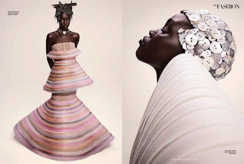 Fashion editorial featuring a woman in tiered gown and architectural headpiece, studio lit against a neutral background. High fashion.