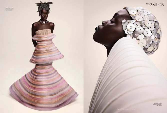 Fashion editorial featuring a woman in tiered gown and architectural headpiece, studio lit against a neutral background. High fashion.