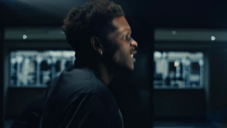 A basketball video features athletes running, driving cars, and competing for the championship cup in a high-energy cinematic sports campaign.