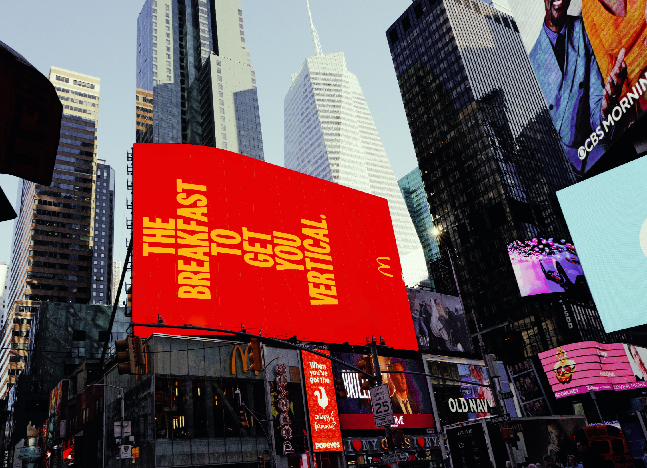Bright billboard in Times Square, New York City, promotes McDonald's breakfast with skyscrapers visible in the background.