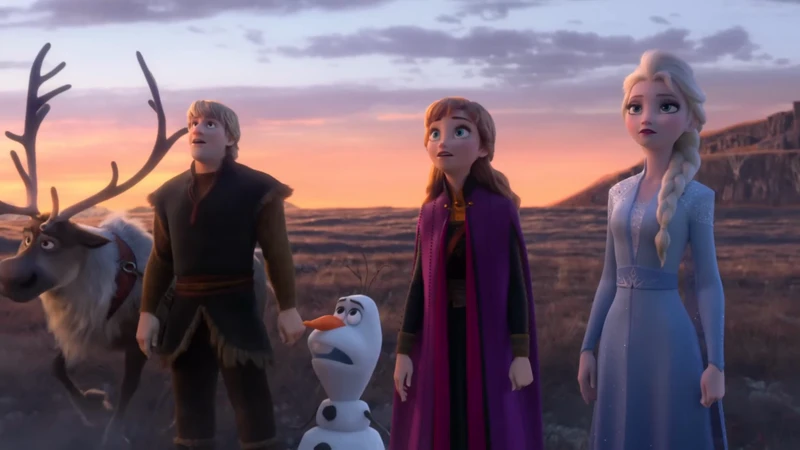 Animated characters from 'Frozen 2': Elsa, Anna, Kristoff, Olaf the snowman, and Sven the reindeer, set against a colorful sky.