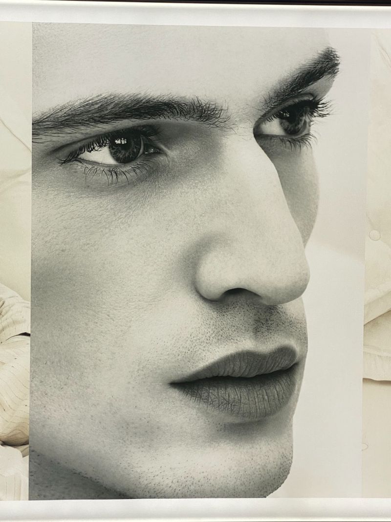 Monochrome fine art portrait of a man's face in profile, captured with detailed rendering in a photo studio with diffused lighting.