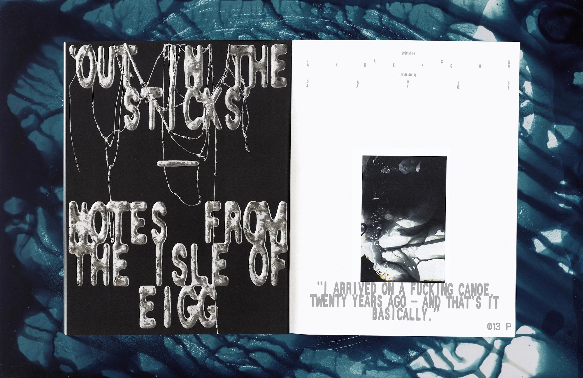 Open book with metallic silver lettering on a dark background paired with an abstract photograph and text, set against a blue backdrop.