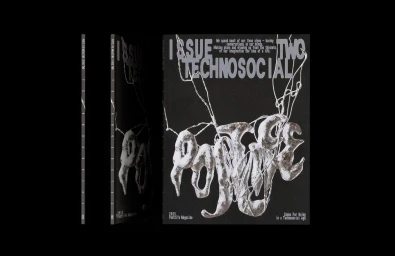 Magazine cover with black background and silver metallic sculptural typography spelling Postlife
