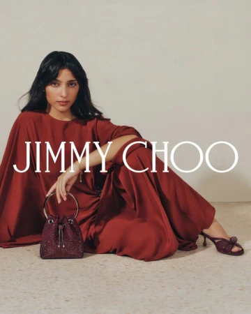 Indoor shot features a woman in a red dress holding a sequin bucket bag and wearing heels, alongside the Jimmy Choo logo.