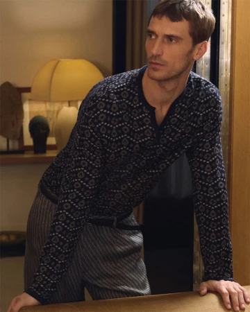 Clement Chabernaud in patterned long-sleeve knit shirt and patterned trousers for Giorgio Armani