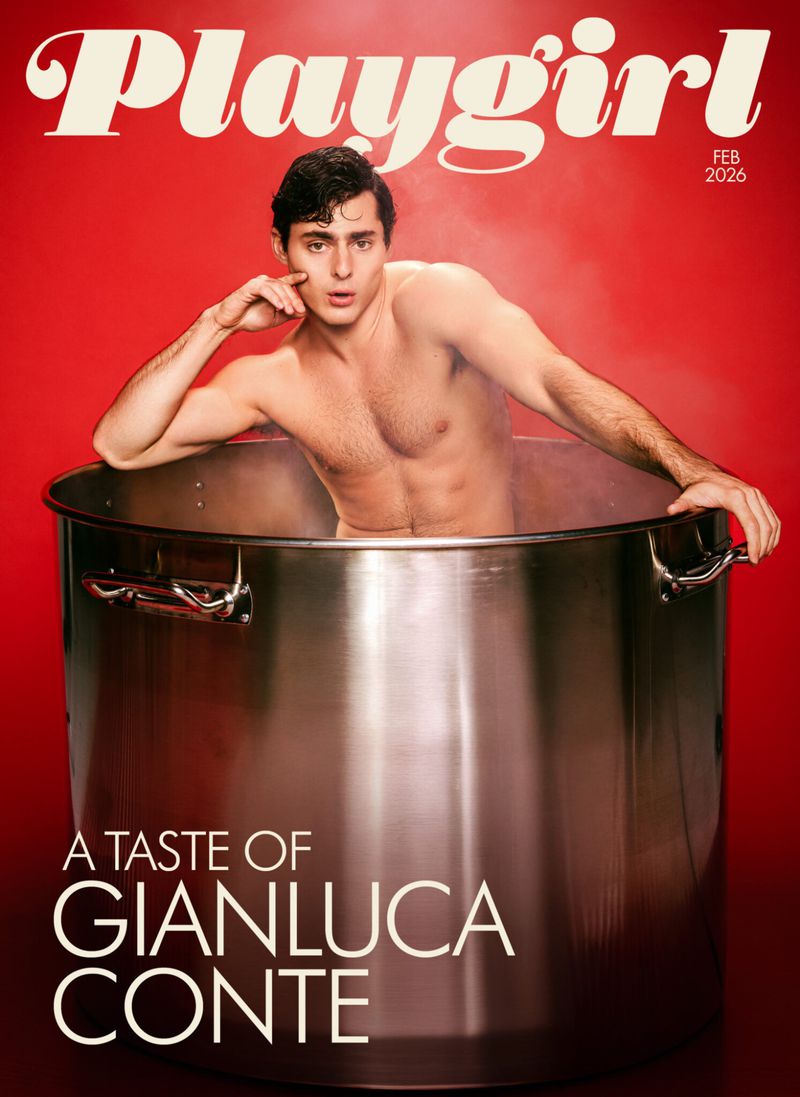 Shirtless man poses inside an oversized metal pot on the cover of Playgirl magazine against a red background with white magazine text.