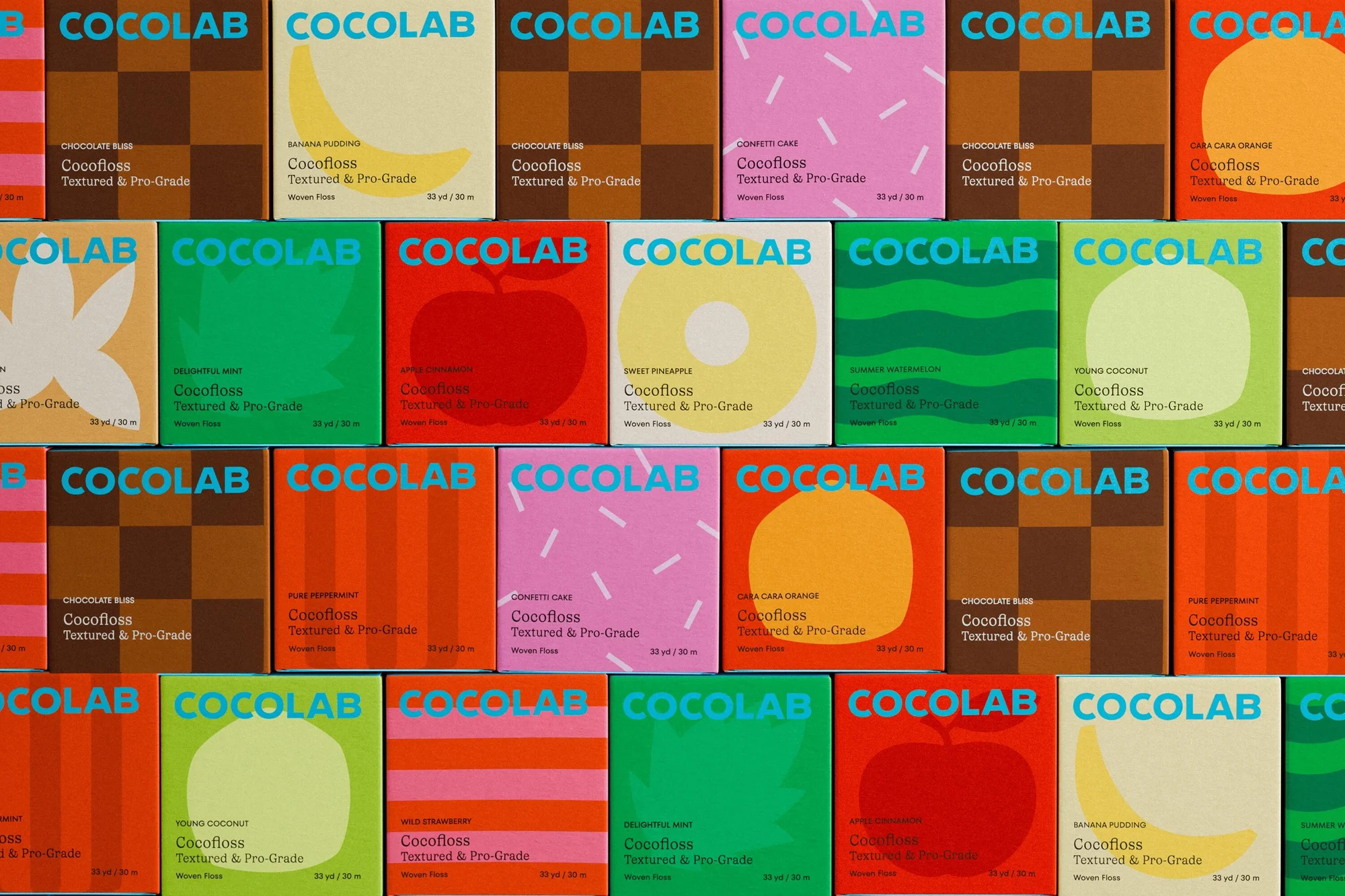 Colorful assortment of Cocolab Cocofloss dental floss boxes with various flavor names and designs, arranged in a stacked, repeating pattern.