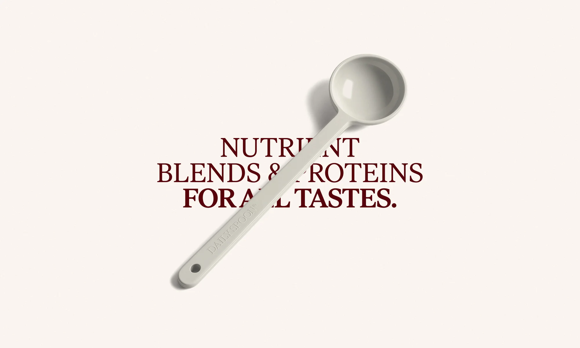 White plastic scoop on a cream-colored background with burgundy text about nutrient blends and protein for all tastes.
