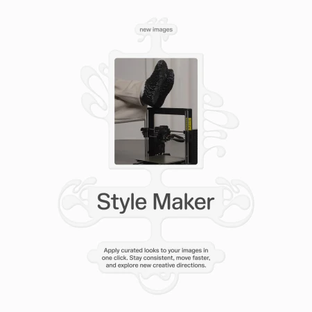 Image of a 3D printer with a shoe-like object on top of it, placed on a table against a neutral background.