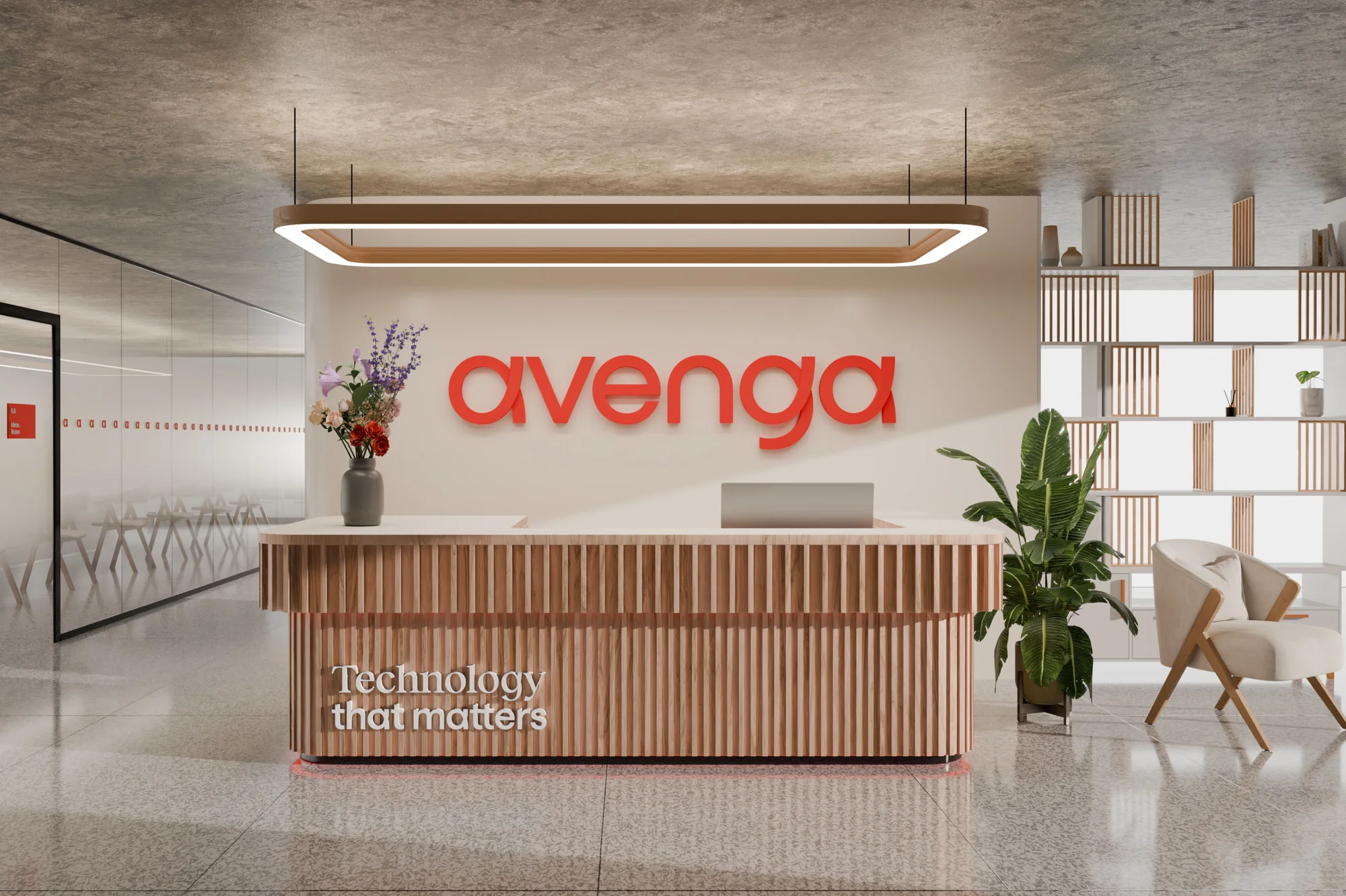 Reception area with wood reception desk, plants, lounge chair, and the word "avenga" in red on the wall in the background.