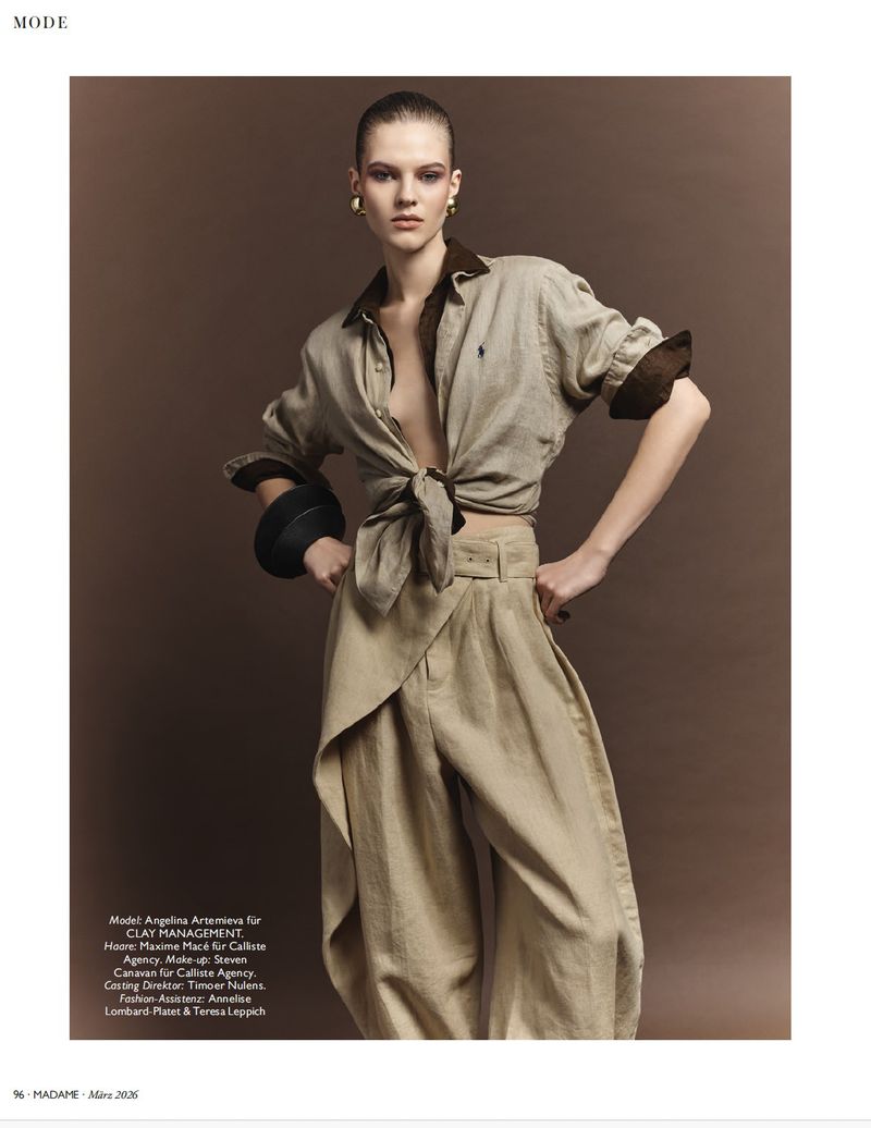 A woman in a stylish tan linen outfit poses against a neutral background, showcasing fashion, textiles, and studio photography.