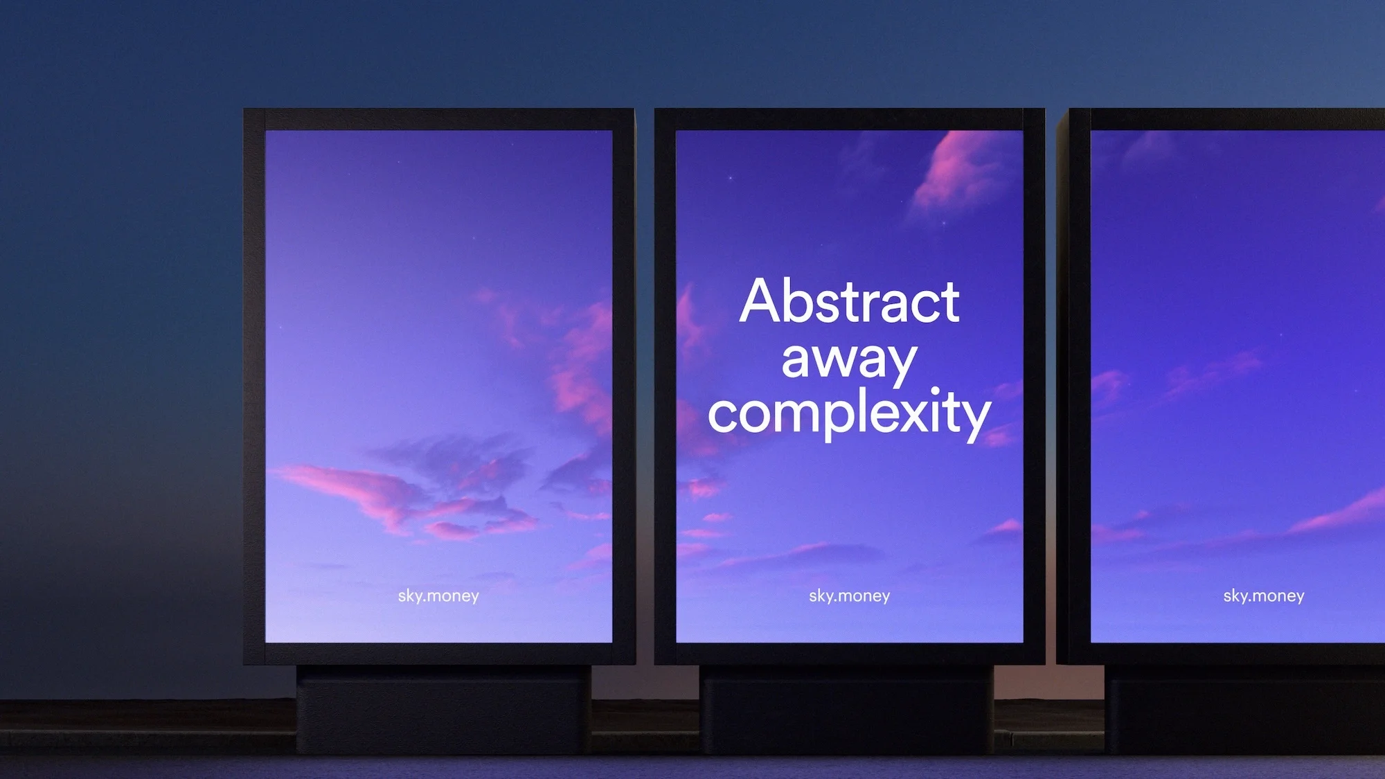 Three digital billboards display a gradient purple sky with faint clouds and the text, 'Abstract away complexity' and 'sky.money.'