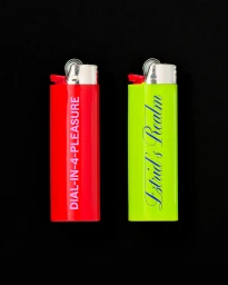 Two lighters, one red and one lime green, positioned vertically against a plain black background.