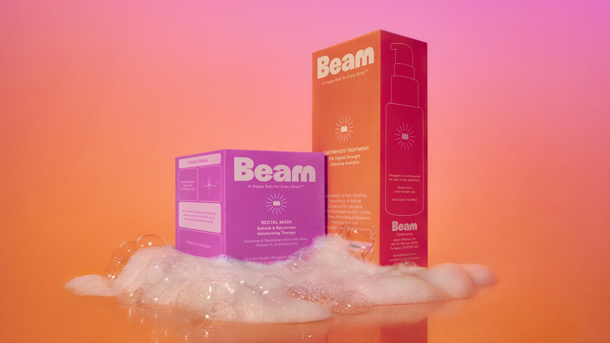 Two Beam brand personal care product boxes, one orange and one purple, are shown with white foam against an orange-pink gradient background.