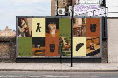 Outdoor billboard featuring NKORA Coffee brand identity with multiple graphic panels, illustrations, and iced coffee photography