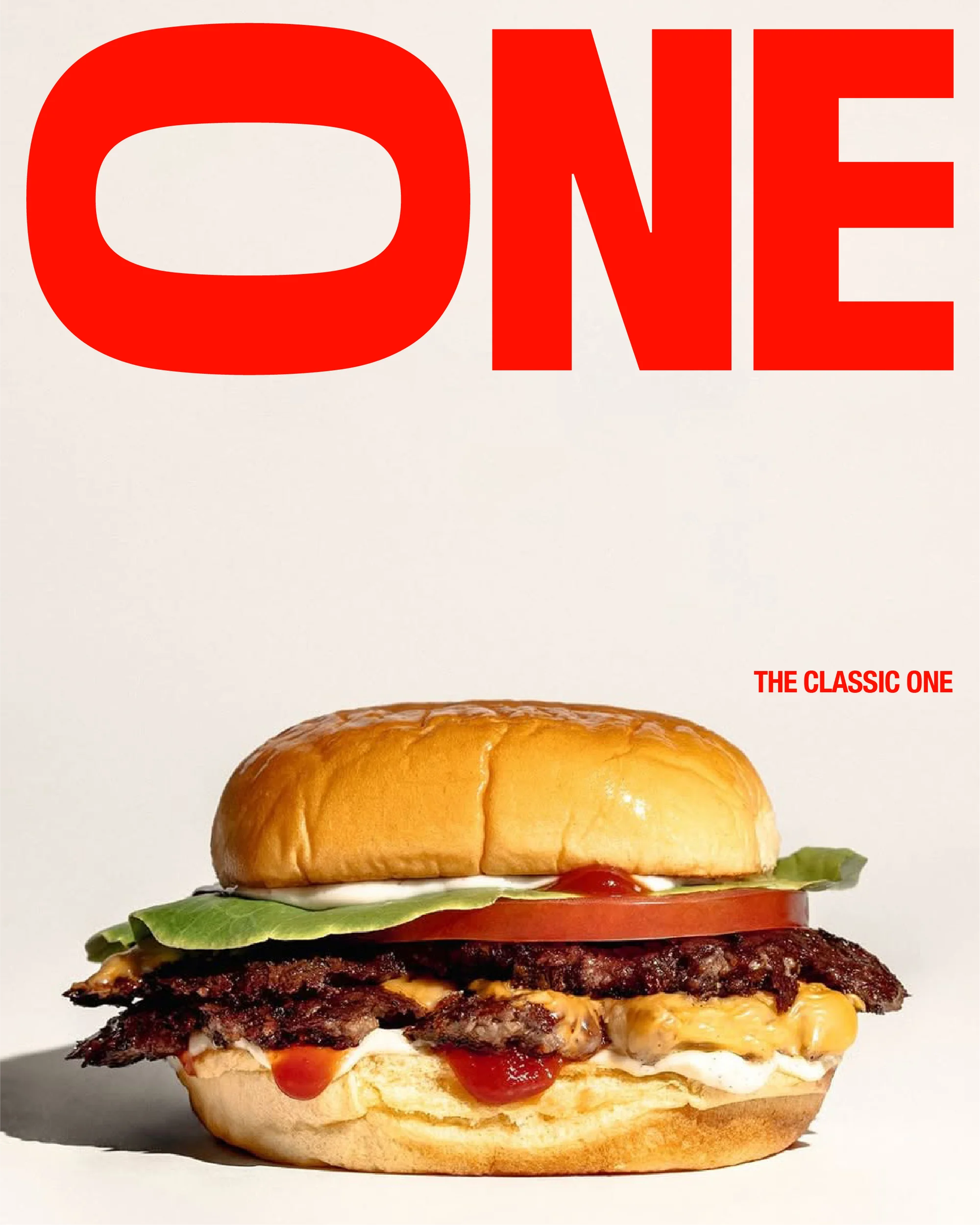 Close-up of a stacked burger with lettuce, tomato, and cheese, accompanied by the bold, red text 'ONE' on a neutral background, promoting a food theme.