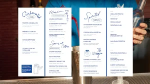 Cocktail menu design and branding for Semiprecious featuring blue typography and illustrations on white paper.
