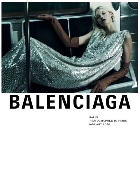 Fashion editorial shot of a woman in a silver sequin dress and brown gloves sitting in a subway, advertising Balenciaga.