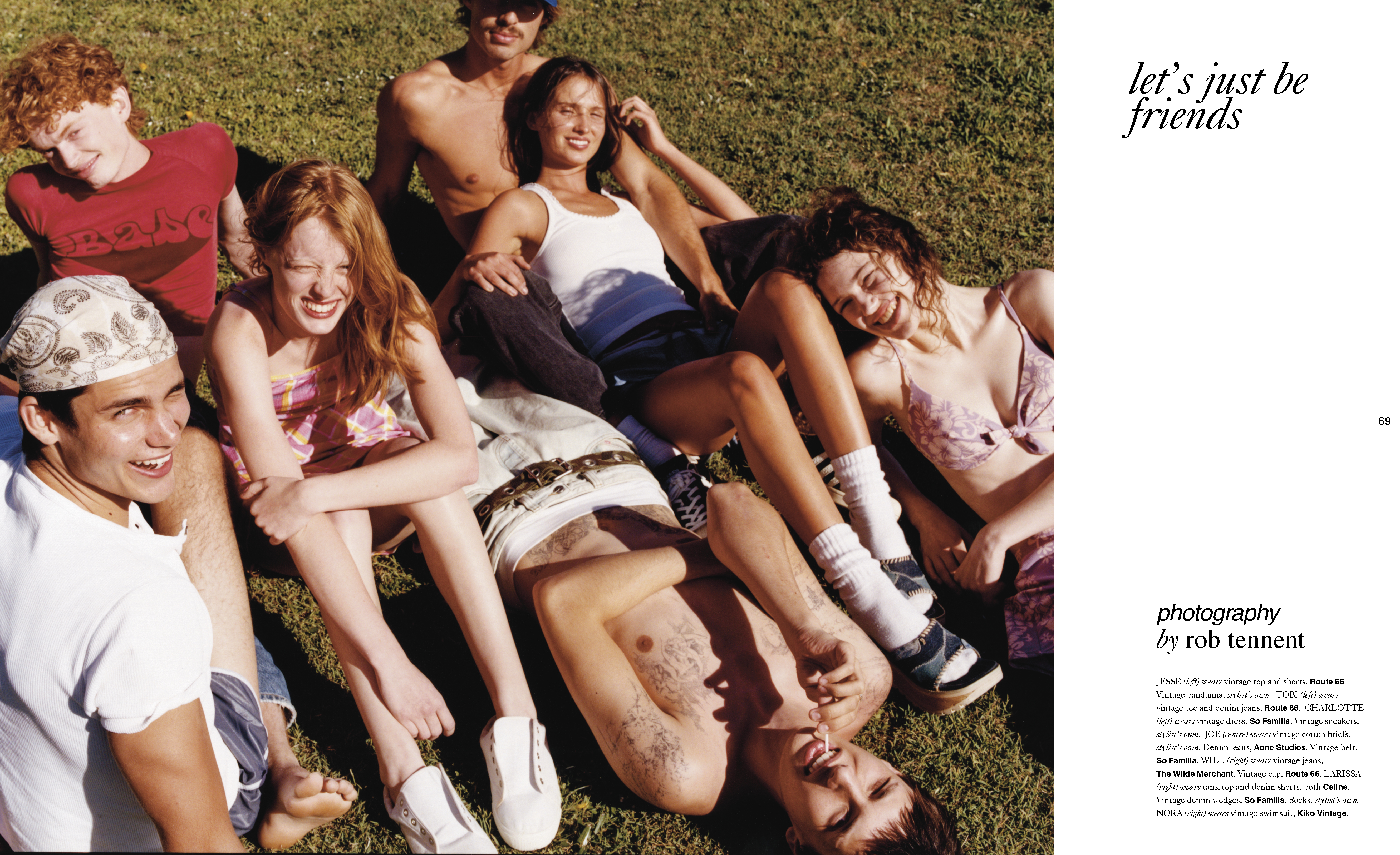 Group of young adults relaxes on grass in sunlit outdoor setting, wearing casual clothing, creating a carefree and joyful atmosphere.