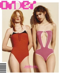 Two models wearing brightly colored swimsuits posing together against a plain wall for Order magazine
