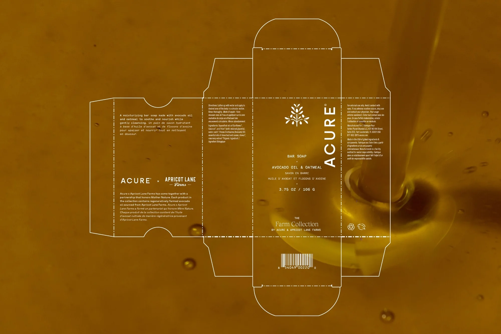 Soap box packaging with Acure brand displayed on a brown background with falling honey. Marketing materials and branding.