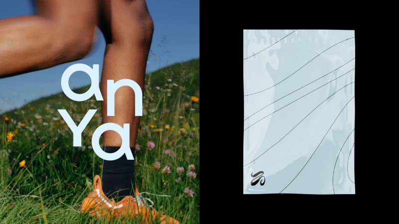 Person in orange running shoe runs through a lush green field with blue sky. A packaging with linear design is on a black backdrop.