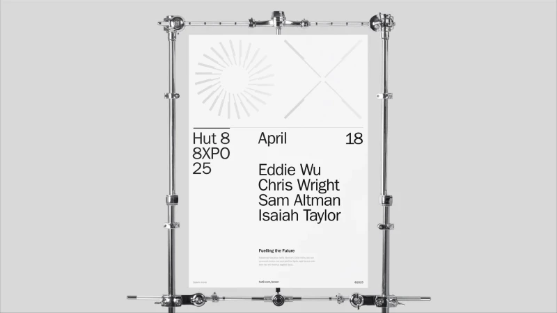 Promotional poster featuring text and geometric shapes held up by a metal stand against a light gray backdrop for a modern, minimalist effect.