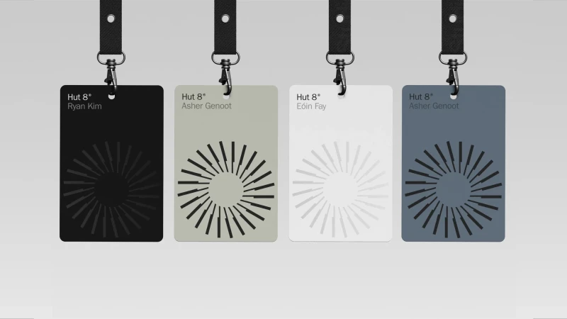 Four branded ID badges with lanyards displayed against a plain light grey background featuring geometric circular patterns.