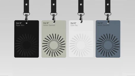 Four branded ID badges with lanyards displayed against a plain light grey background featuring geometric circular patterns.