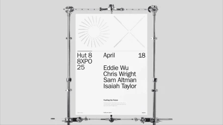 Minimalist graphic design poster for Hut 8 mounted in a chrome studio pipe frame against a plain light grey background