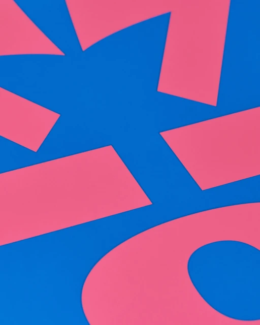Abstract composition with pink geometric shapes on a vibrant blue background, creating a modern and minimalist design.