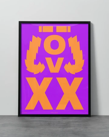 Graphic art print in black frame against white wall: orange abstract text and shapes on purple background, flat lay composition.