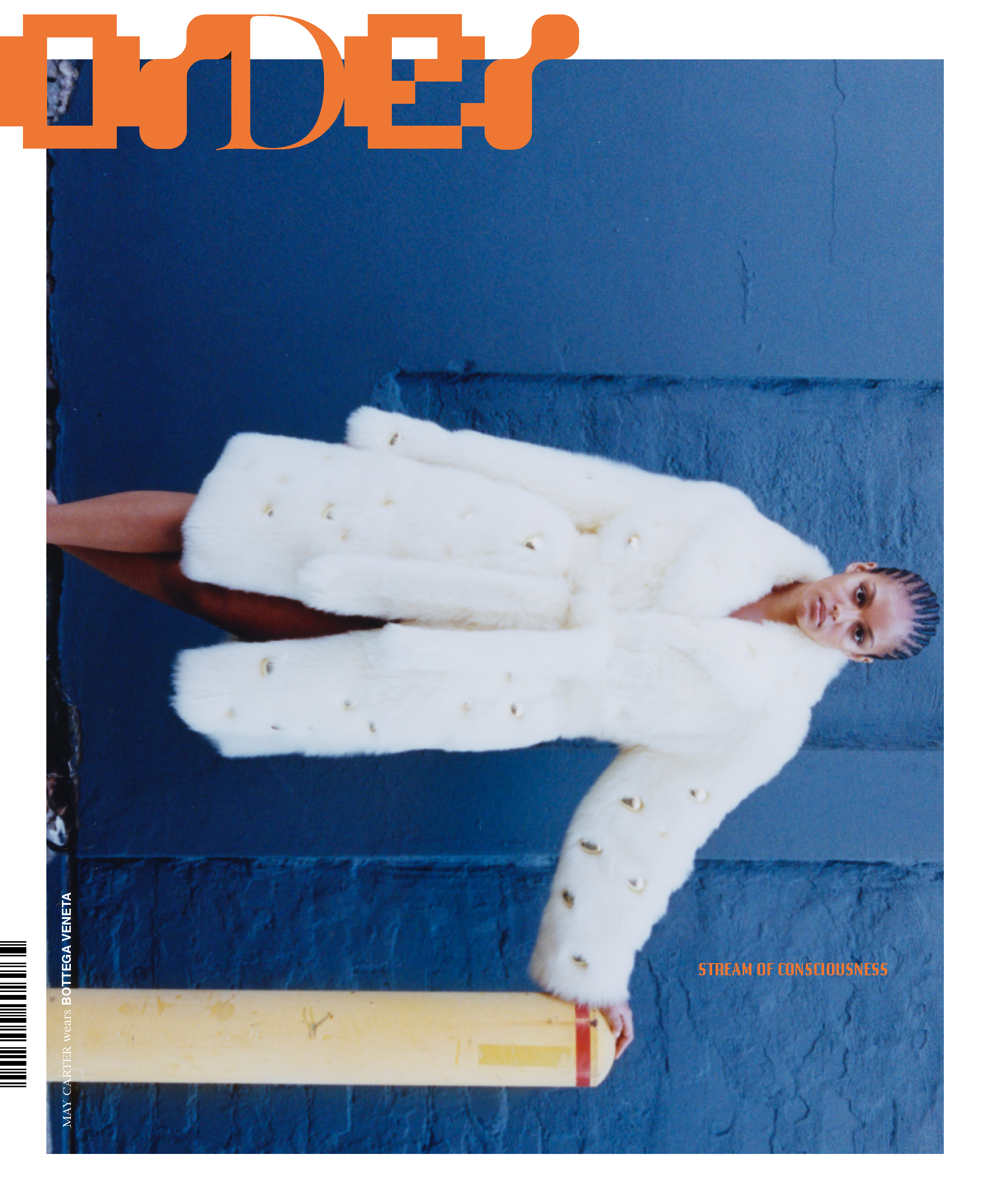 Magazine cover featuring a woman in a white fur coat posing against a blue wall with orange text reading 'ORDER' at the top.