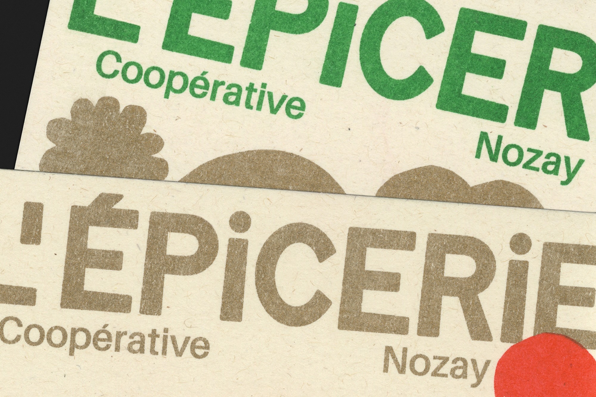 Close-up of two 'L'ÉPICERIE Coopérative Nozay' logos, one green, one beige, on a grainy, light beige surface, casting subtle shadows.
