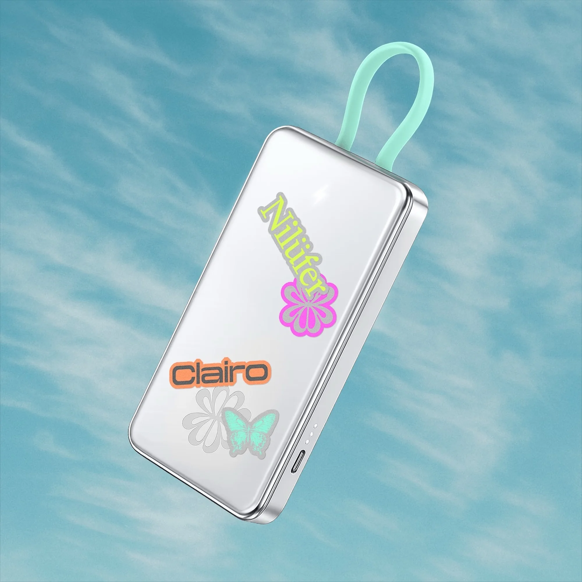 Floating portable charger with stickers in a blue sky. Decorative and functional for mobile power on the go, simple design.