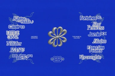 Blue graphic design poster featuring silver metallic typography and festival line-up names set against a textured background