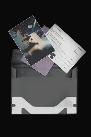 Open grey envelope with visible postcards and a purple letter, set against a black background in a simple, graphic style.