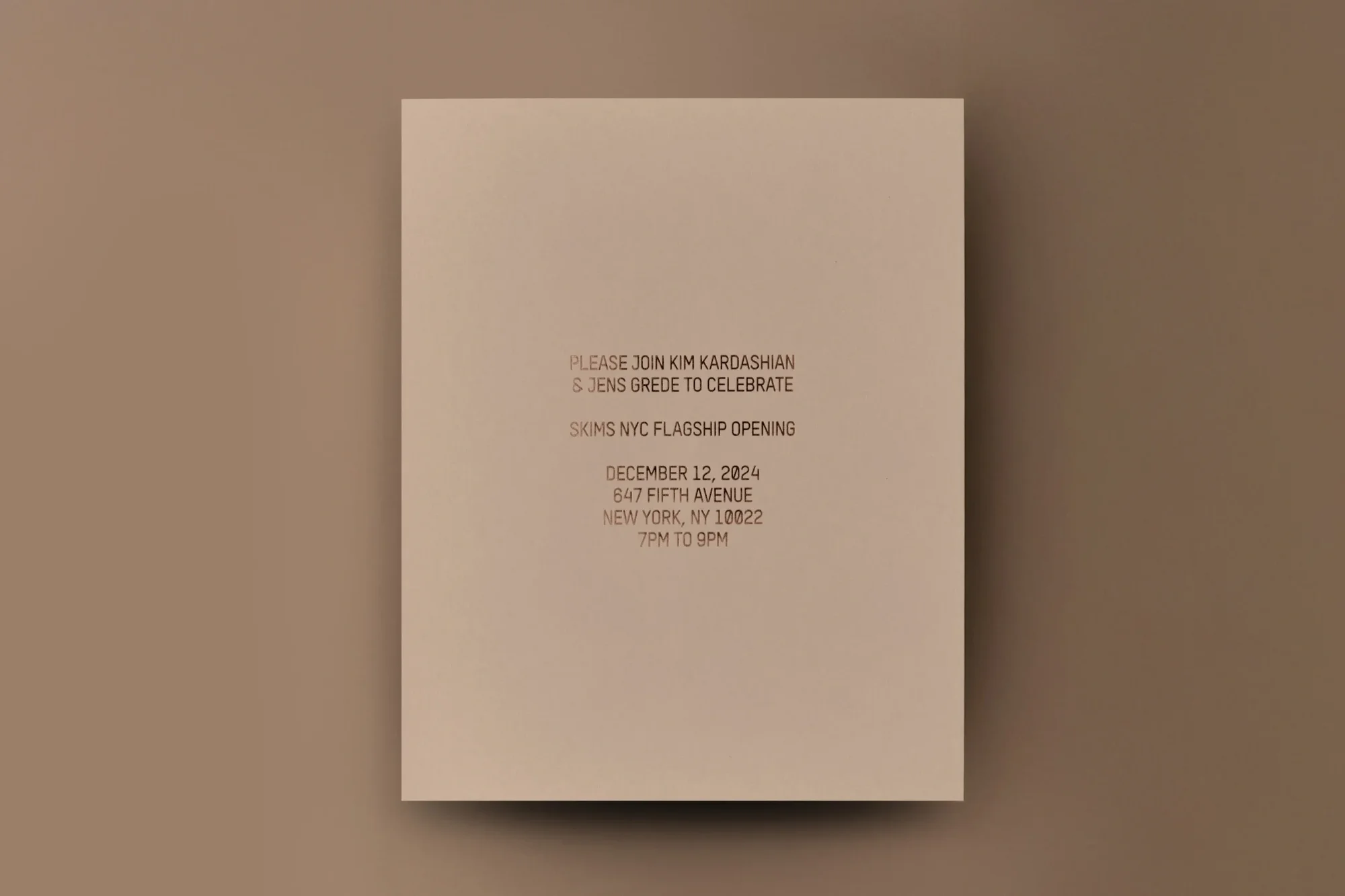 Invitation to SKIMS NYC flagship opening on a beige card with dark brown text including Kim Kardashian and Jens Grede; minimal design.