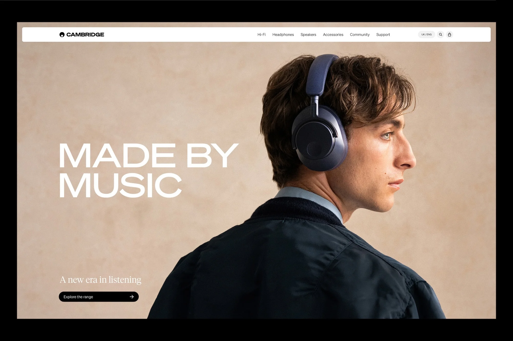 Man wearing blue over-ear headphones looking right in a closeup studio shot with text overlay. Cambridge brand. Music industry visual.