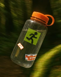 Clear water bottle with orange cap and branded stickers featuring a running pixel figure against a blurred green forest background