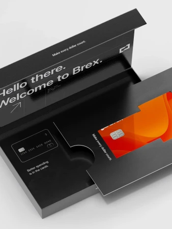 Promotional image of a Brex credit card in a black cardholder on a white background, showcasing modern financial technology.