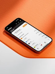 Smartphone displaying a finance app UI on a textured orange and white gradient surface.