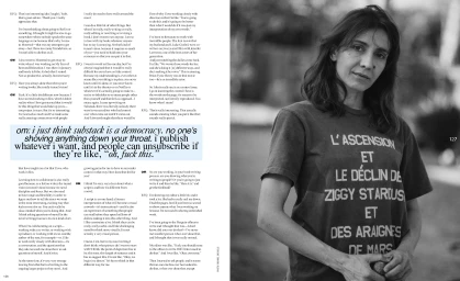 Portrait of a woman wearing a graphic t-shirt with French text against a blurred outdoor background, photographed by Zoe Davidson for Order.