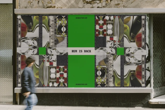 Person walks past a colorful collage-style ad for rum on a city street featuring bottles, fruit, and bold green accents.