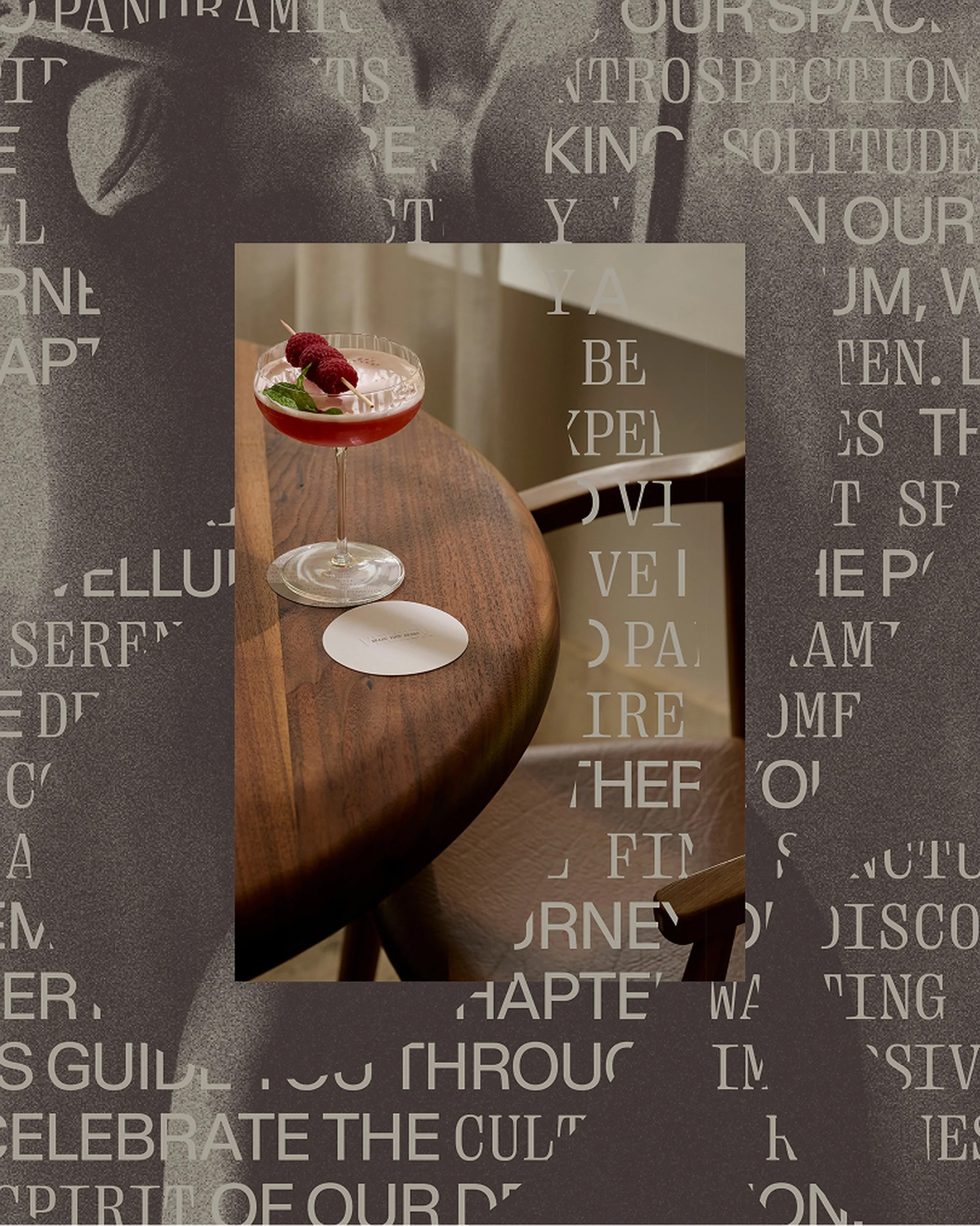 Raspberry cocktail on wooden table with coasters. Drink with fruit garnish against a textured, typographic backdrop creates a muted, elegant scene.