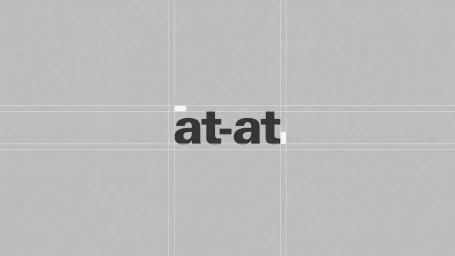 A typographic brand identity logo reading at-at centered on a neutral grey background with grid alignment lines.
