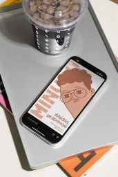 Smartphone displaying an illustrated graphic and a clear plastic coffee cup on a silver tray for Minubu Coffee brand identity