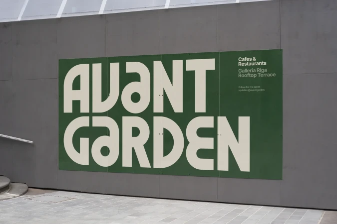 Outdoor advertising poster for Avant Garden Cafes & Restaurants, Galleria Riga Rooftop Terrace, featuring a modern, bold typography design.