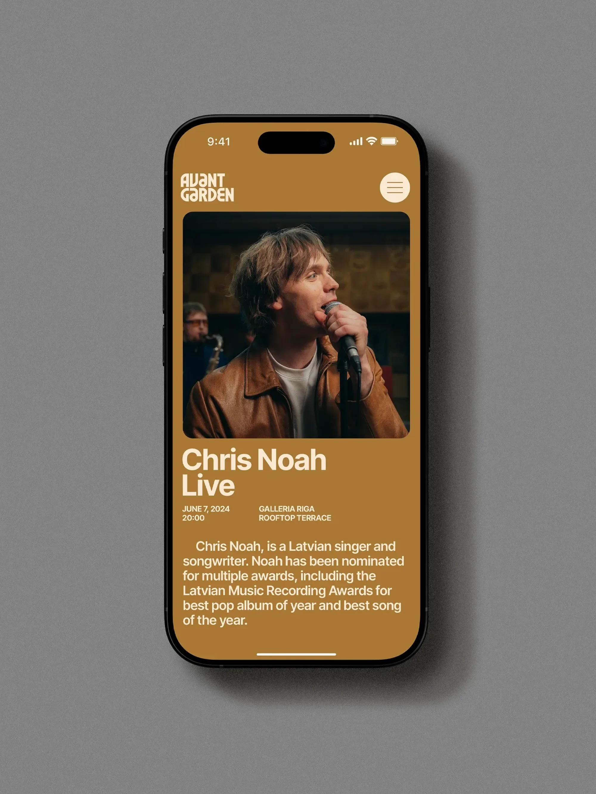 Smartphone screen displays Chris Noah live concert advertisement with event details, against a grey studio backdrop. Avant Garden branding.